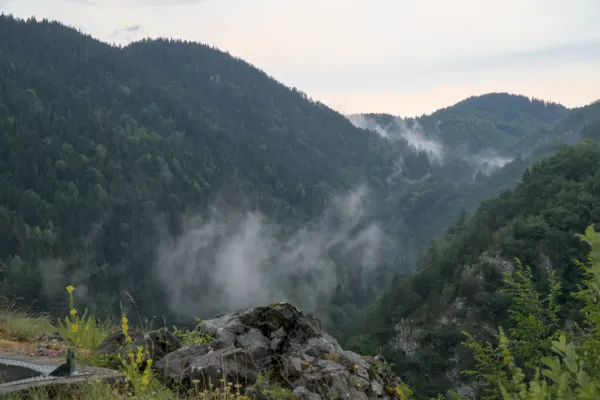 Morning fog in the mountains rises over Zaovine Lake in Tara National Park, Serbia.