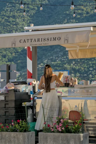 Gelateria in Perast, Montenegro, with an ice cream seller in summer.