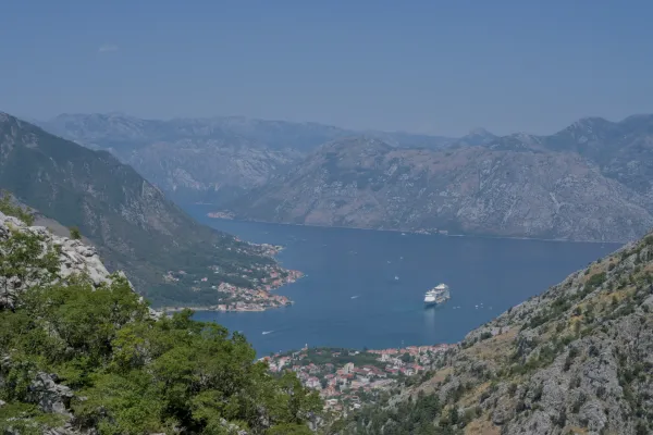 Top view of the Bay of Kotor in Montenegro with an approaching cruise ship.