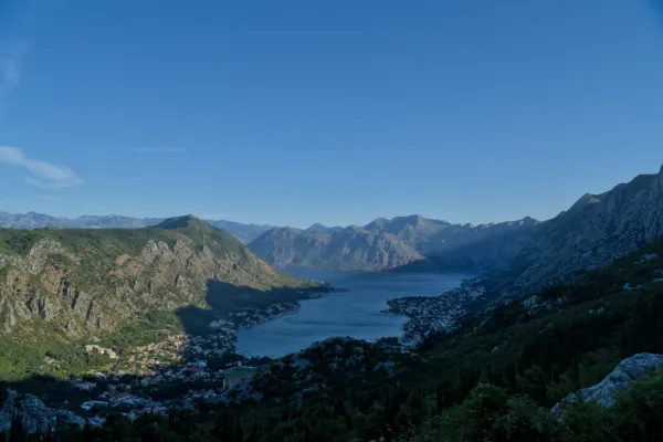 Pre-dawn view of Kotor Bay, Montenegro, overlooking the town and mountains from a mountain serpentine road.