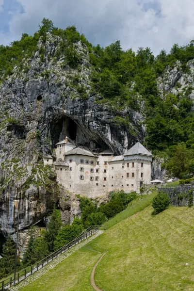 Predjama Castle, 'Predjamski grad', built into a cliff face in Postojna Cave, Slovenia, showcasing a stunning architectural feat.