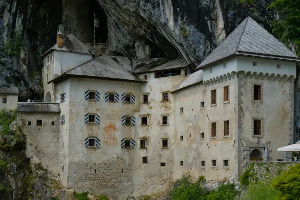 The famous Predjama Castle is built into a cliff face, offering an impressive view.