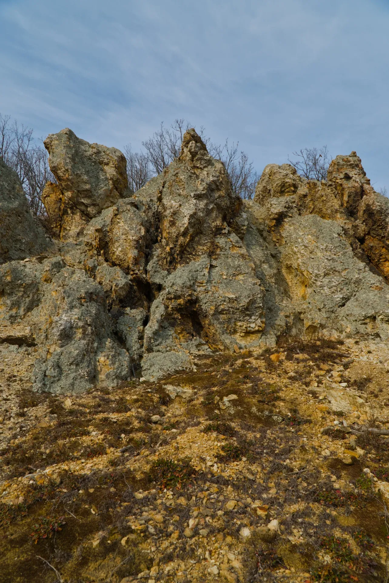 Orlovy Stone rock formations on Fruska Gora at the end of winter, showcasing rugged textures and natural light.